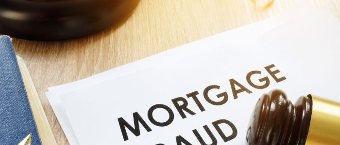 Documents about Mortgage fraud and gavel in a court.