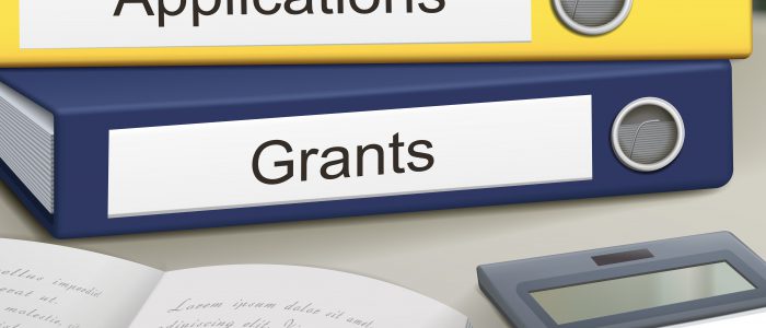 applications and grants binders isolated on the office table